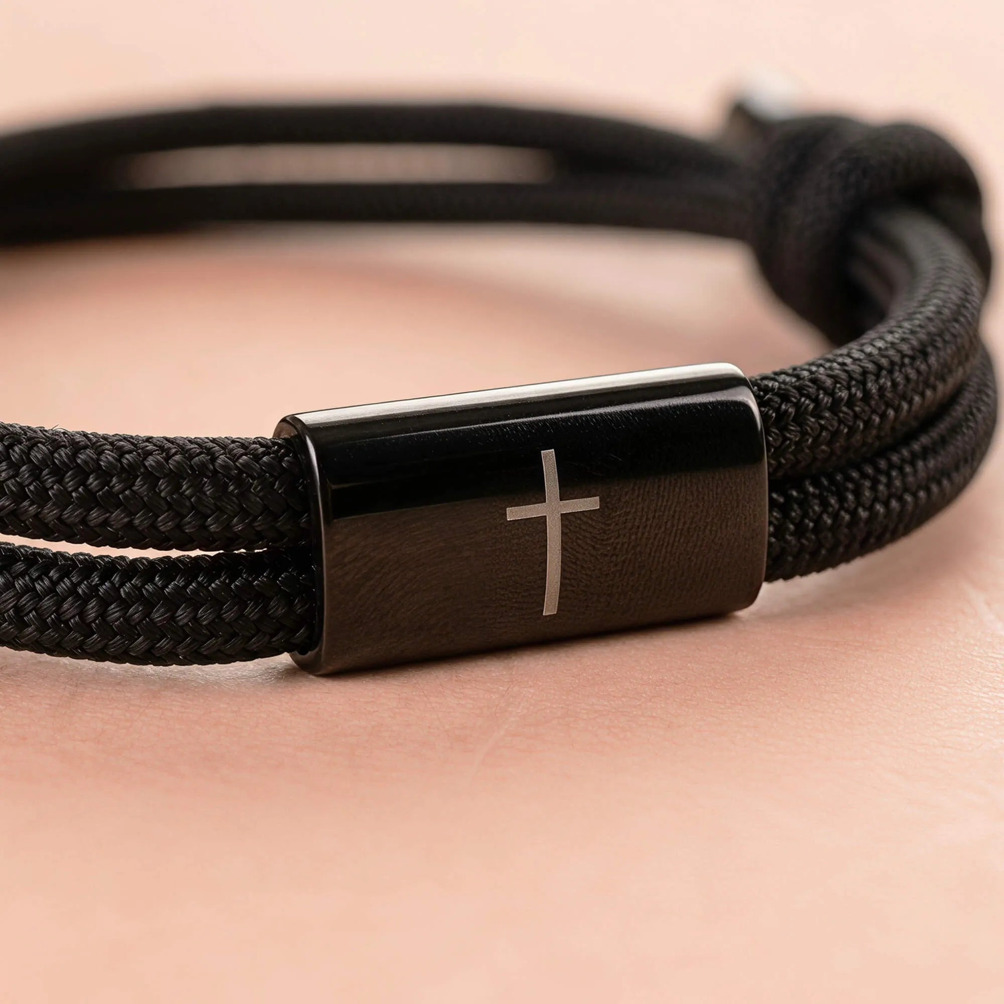 Close-up of Faith Cross Birthday Bracelet showing stainless steel cross