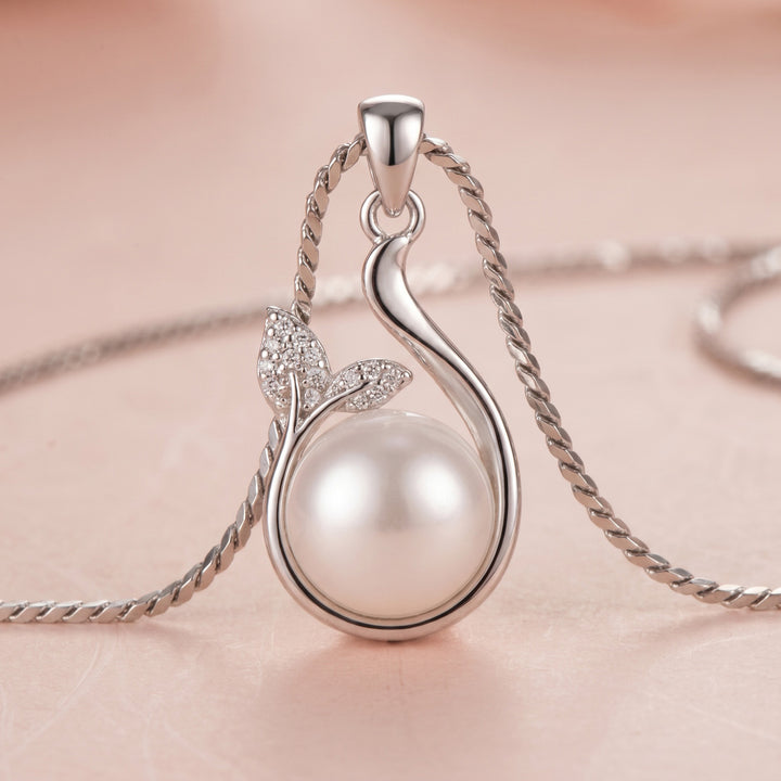 Sterling silver necklace with a freshwater pearl and leaf design