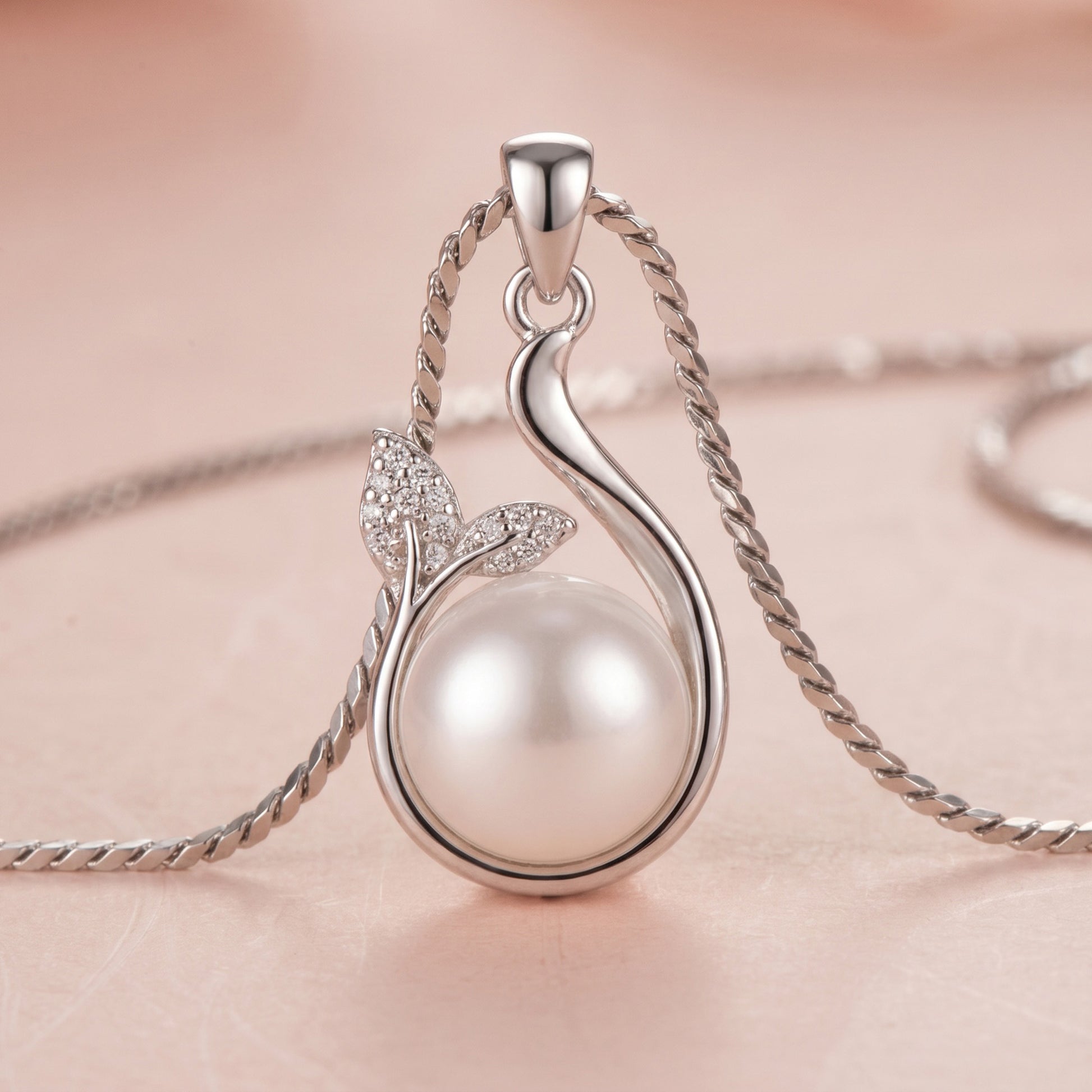 Sterling silver necklace with a freshwater pearl and leaf design