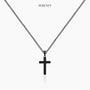 Black cross necklace on display