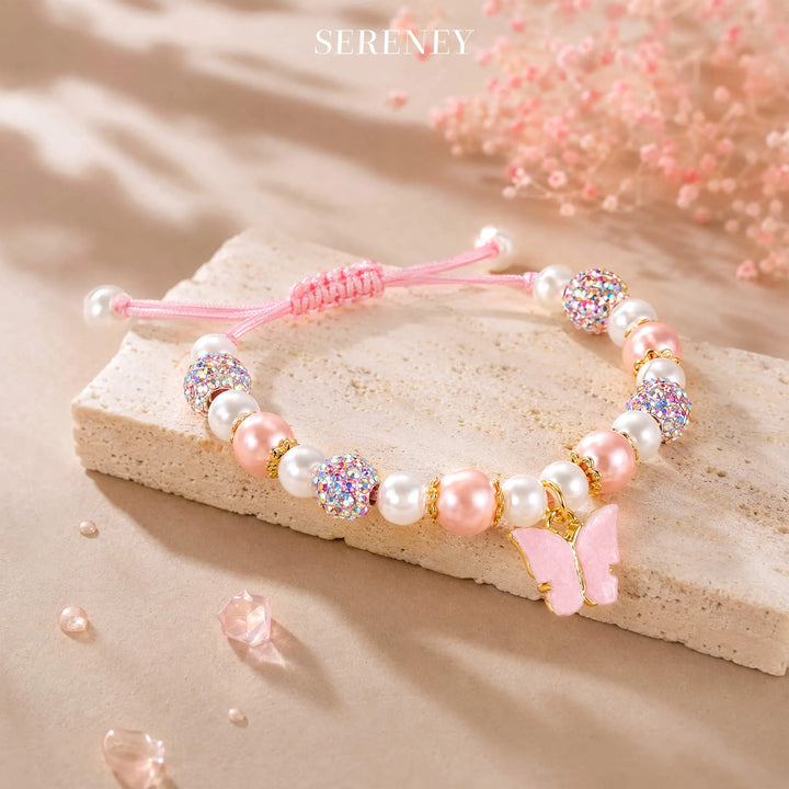 Adjustable bracelet with pink and white beads and butterfly charm