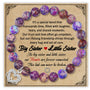 Purple beaded bracelet displayed on decorative card with silver heart charm