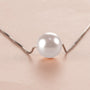 Close-up of the You Are Loved Pearl Necklace showing the pearl and chain
