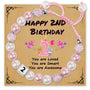 Pink pearl bracelet for second birthday with decorative card