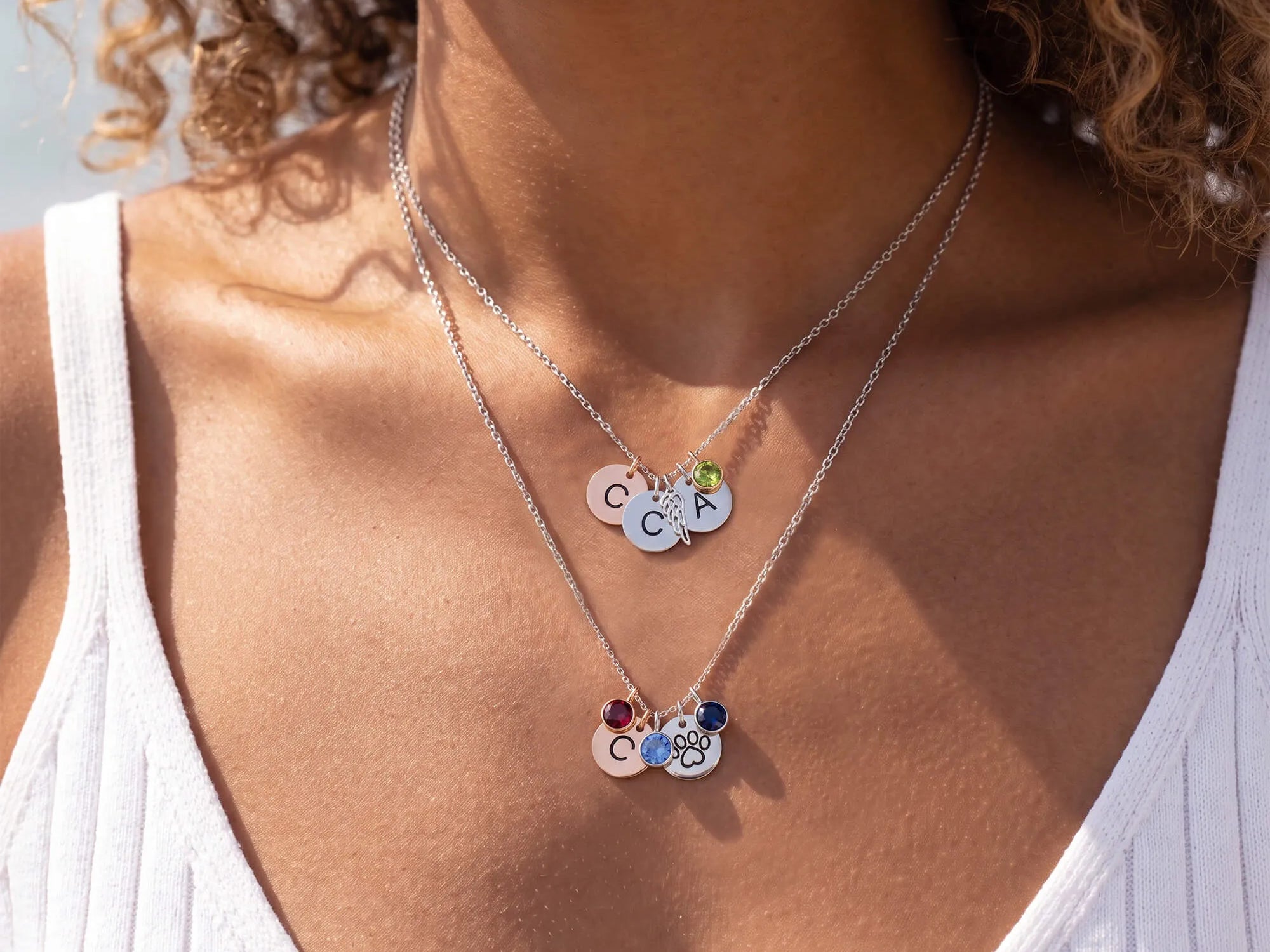 Personalized charm necklace featuring initials and colorful birthstones
