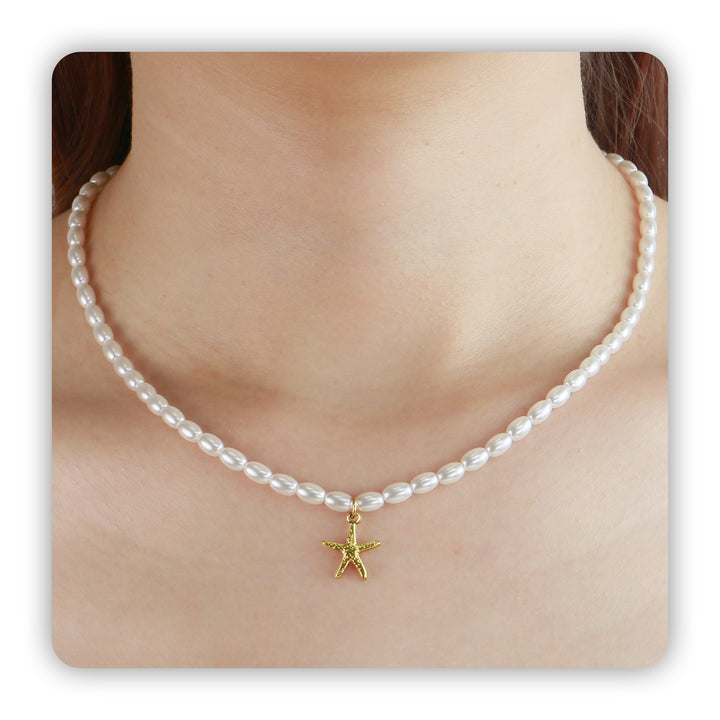 Starfish Pearl Necklace worn on a model's neck