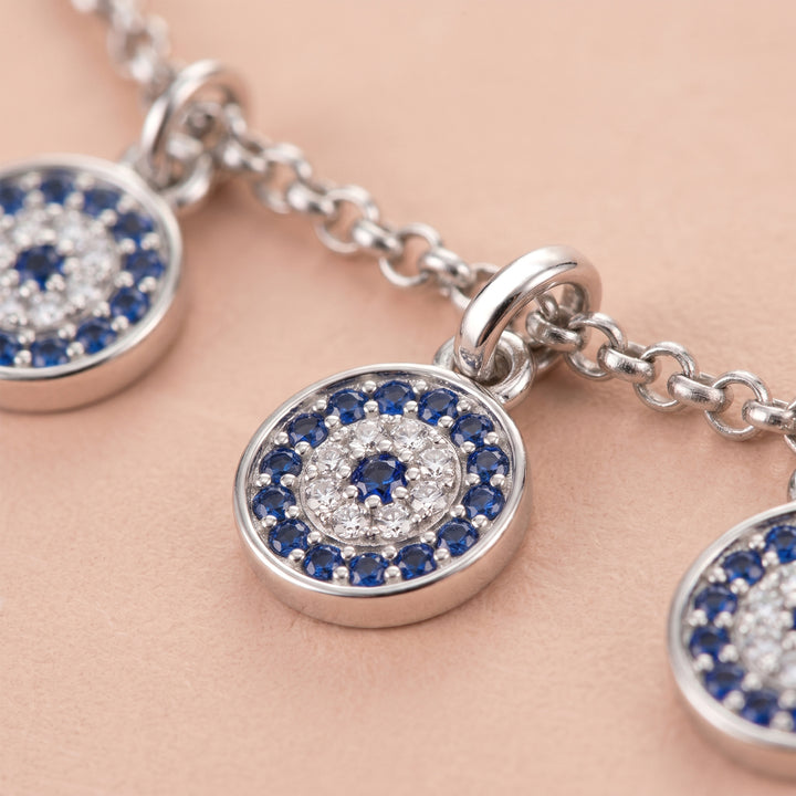Close-up of Evil Eye motifs on the choker necklace