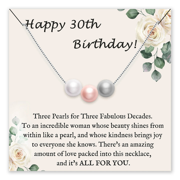 Birthday card featuring three pearls and floral design