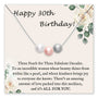 Birthday card featuring three pearls and floral design