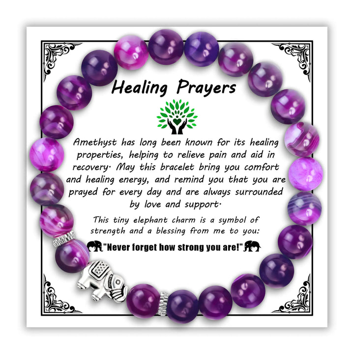 Amethyst bead bracelet with elephant charm on decorative Healing Prayers card