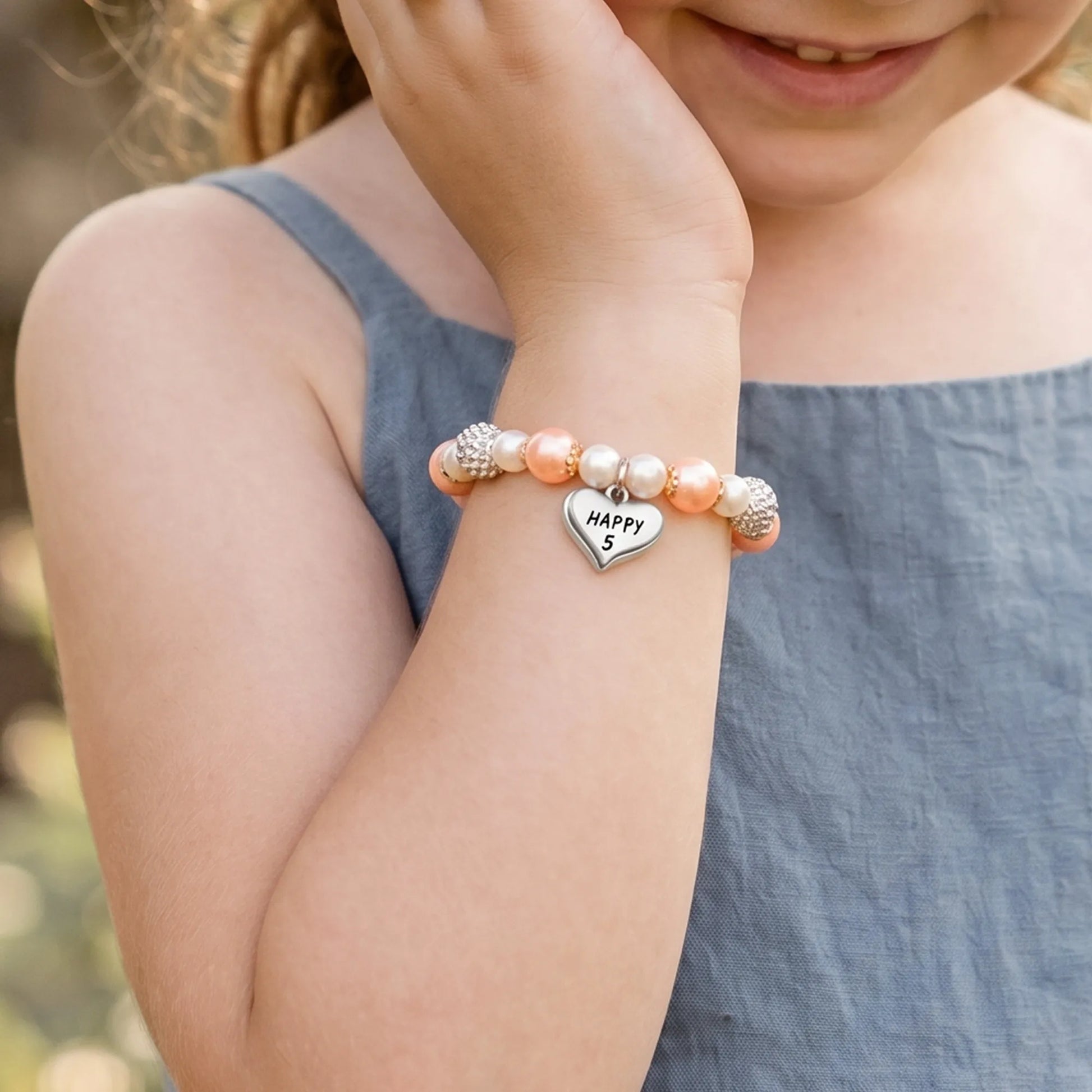 Girl wearing Magical Zebra Jasper Birthday Bracelet for 5th birthday