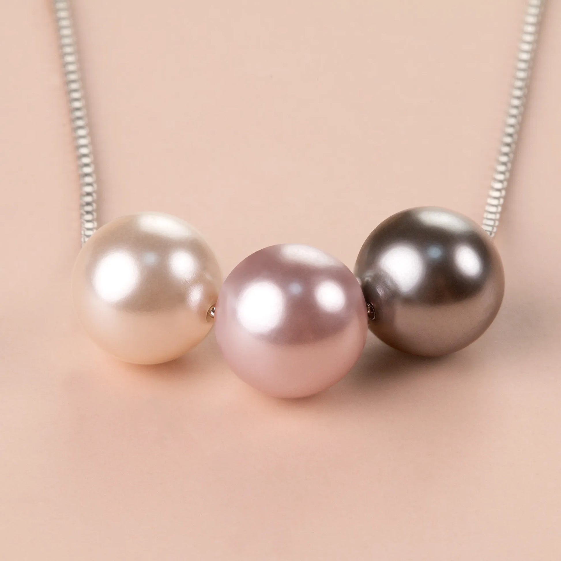 Necklace with three crystal pearls on a silver chain