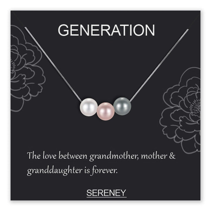 Necklace with three pearls on a black background