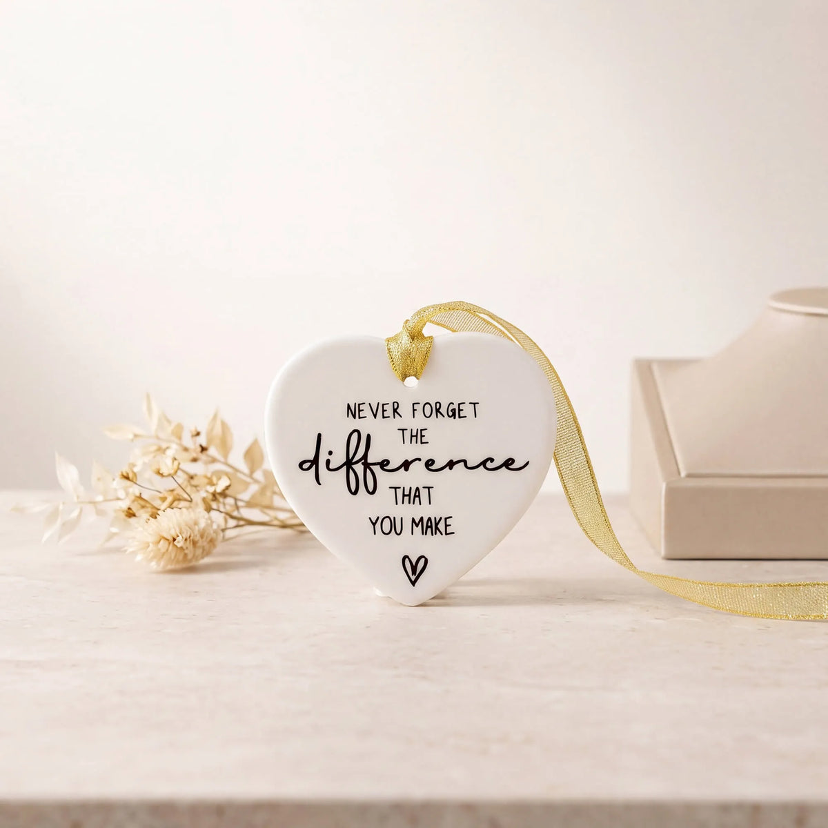 Heart-shaped ceramic keepsake with gold hanging ribbon and printed message