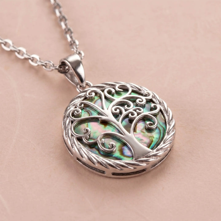 Close-up of Tree of Life pendant on silver chain