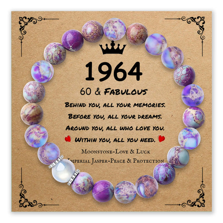 Bracelet with purple and pink beads on a decorative background