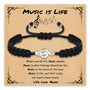 Black braided charm bracelet with treble clef charm