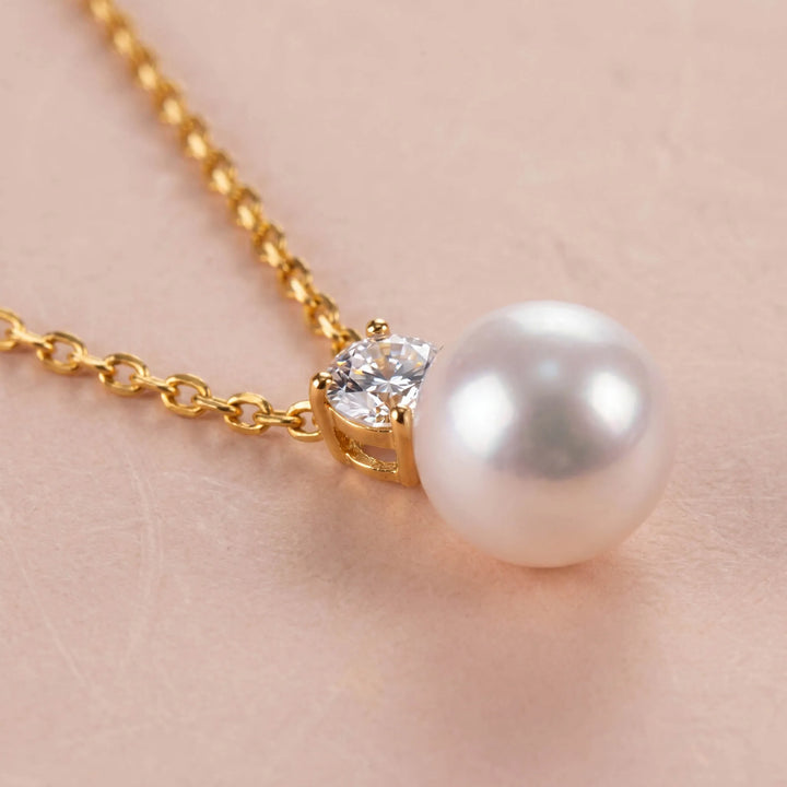 Close-up of pearl necklace with cubic zirconia accent