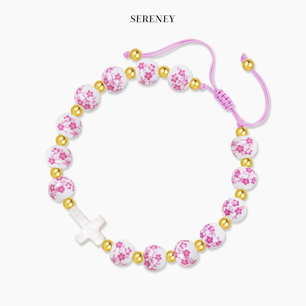 Pink cord beaded bracelet with gold accents and white beads with pink floral print
