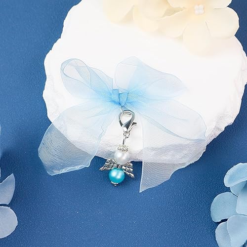 Angel charm on white gift with blue ribbon