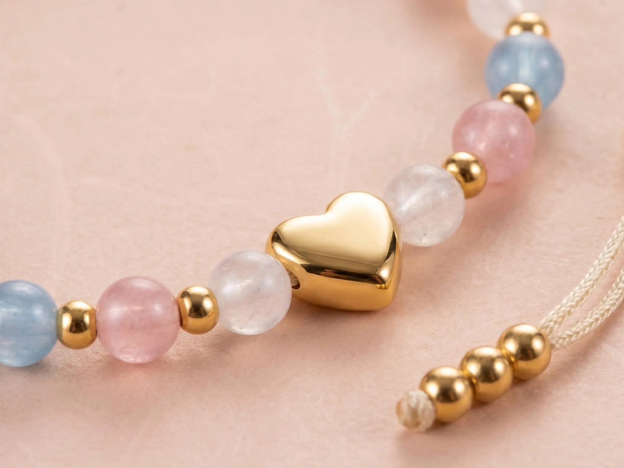 Close-up of bracelet showing heart charm and beads