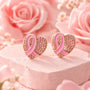 Pair of heart-shaped pink ribbon earrings with enamel center and sparkle details