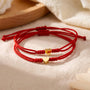 Heart charm red bracelet set displayed on a surface