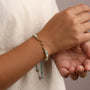 Ocean Wave Birthday Bracelet worn on a wrist