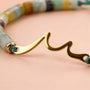 Close-up of the clasp and beads of the Ocean Wave Birthday Bracelet