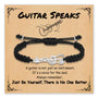 Black braided charm bracelet with guitar charm