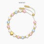 Bracelet with pink, blue, and white beads on display