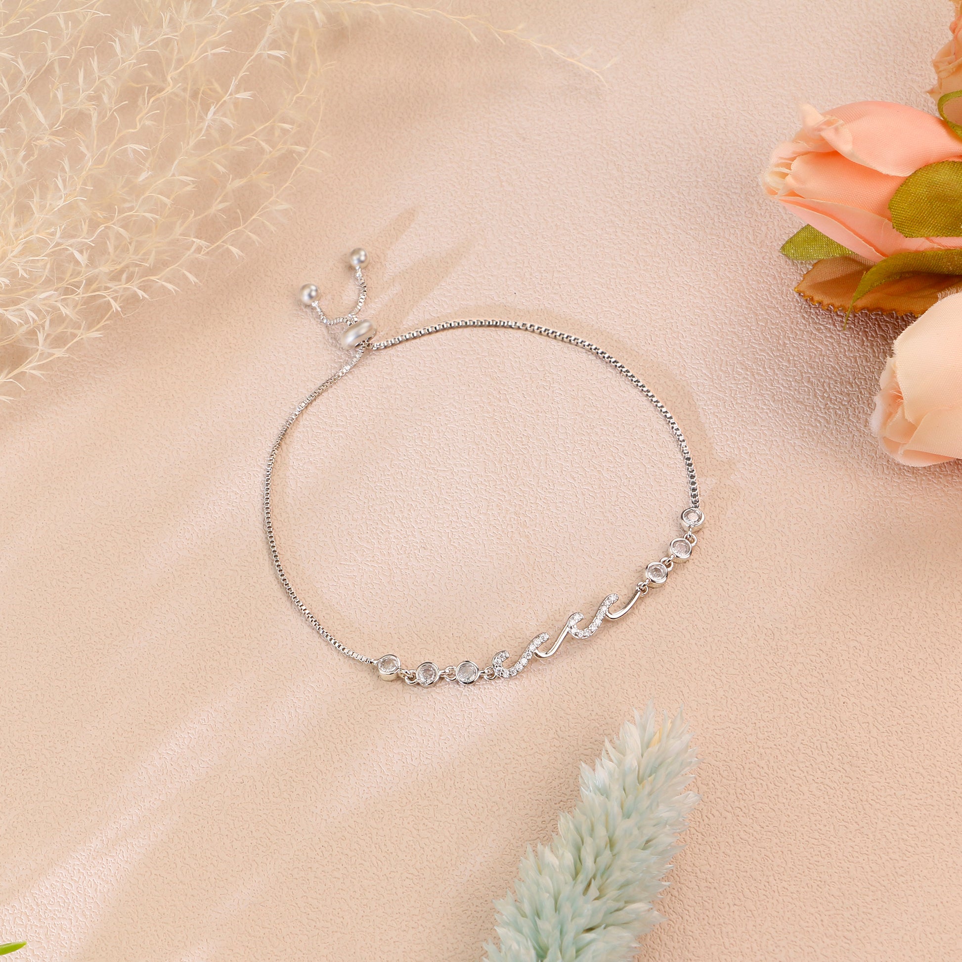 Adjustable silver bracelet displayed on a soft surface