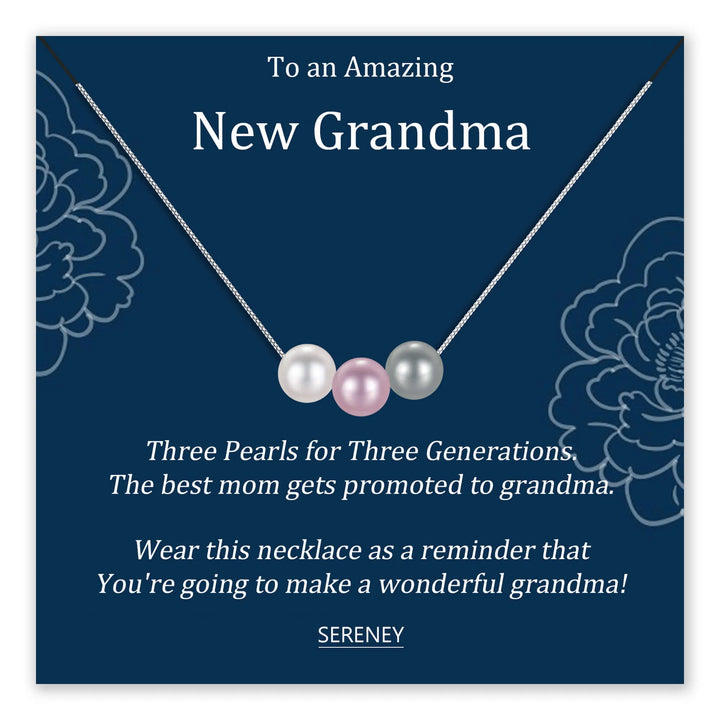 Necklace with three pearls on a dark blue background
