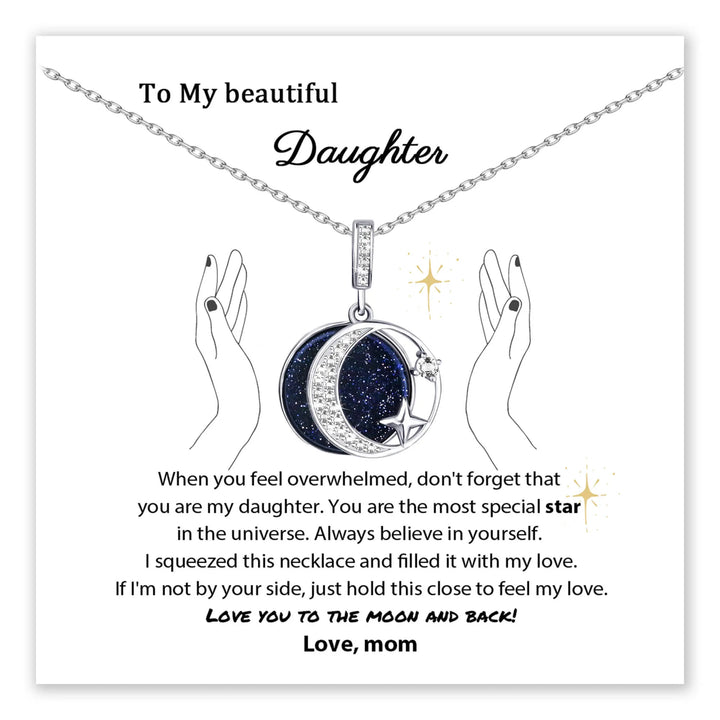 Daughter necklace with a moon and star pendant on a card